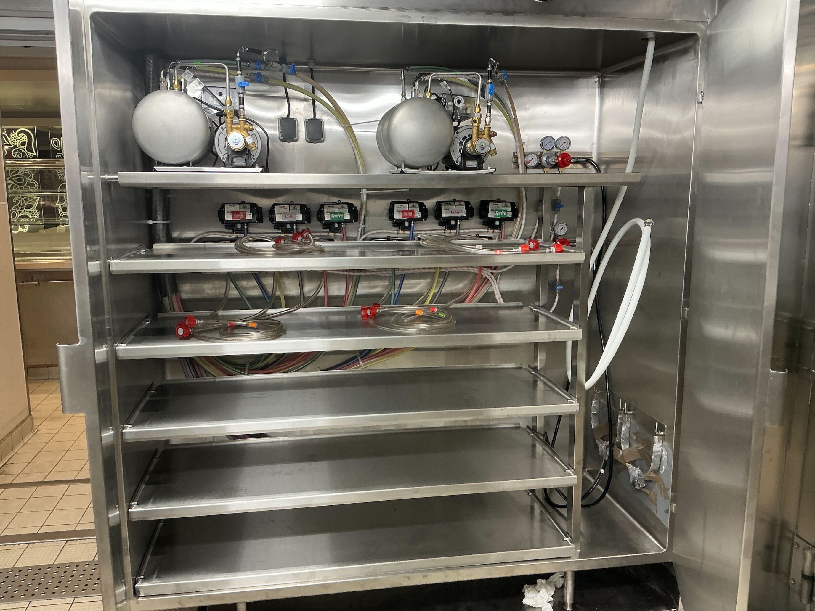 Coca-Cola and Sprite beverage system installation with CO2 regulators and syrup lines