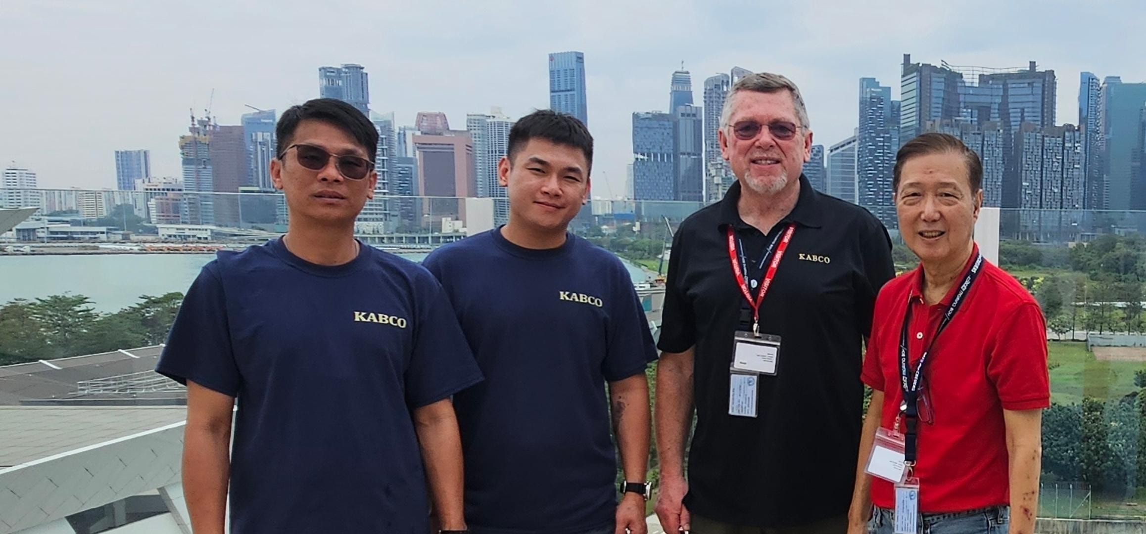Kabco team with Singapore skyline backdrop