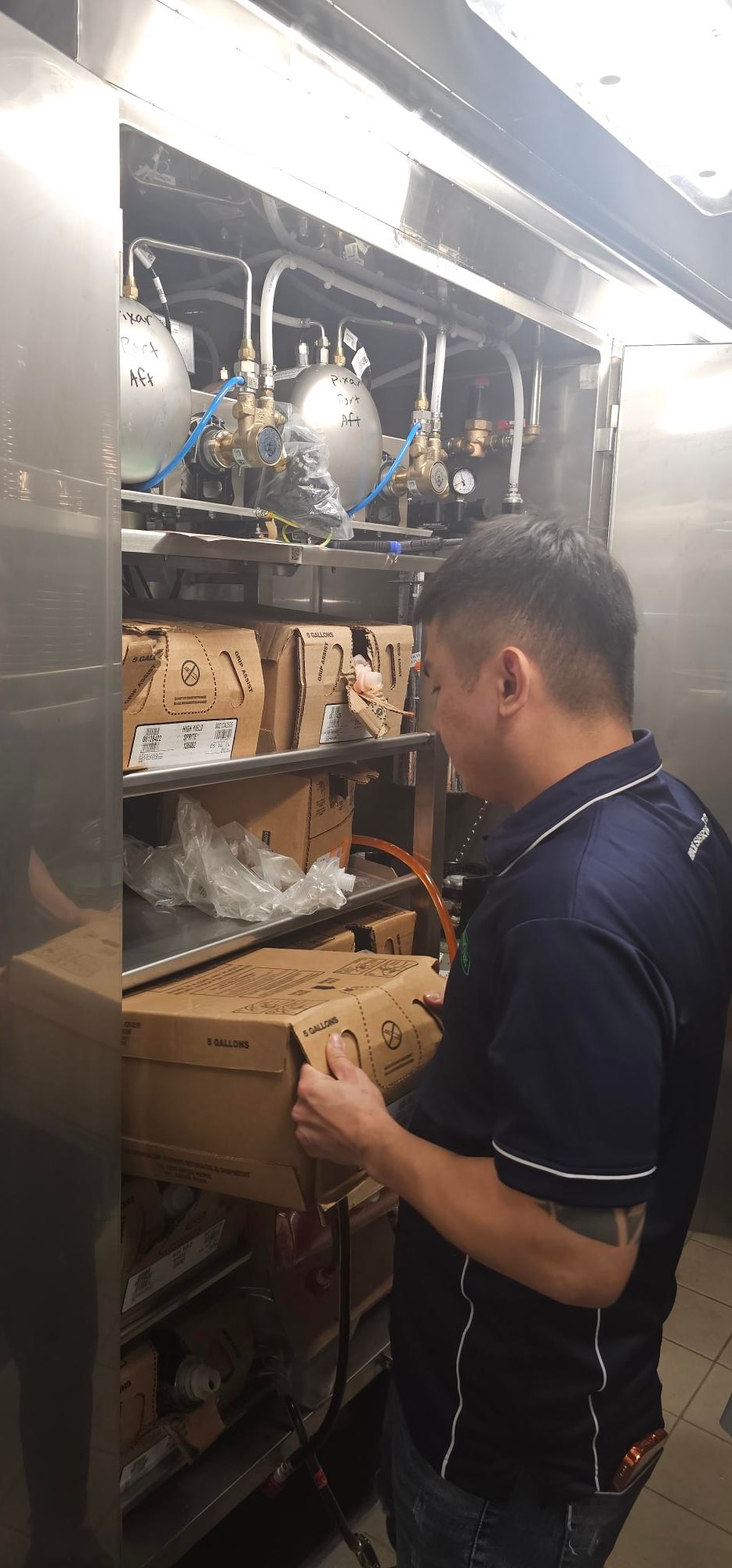 Kabco technician performing internal service on beverage equipment