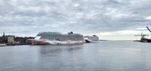 Large cruise ship docked in harbor